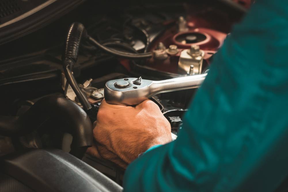 Mechanics checking and repairing the car. Car auto services concepts