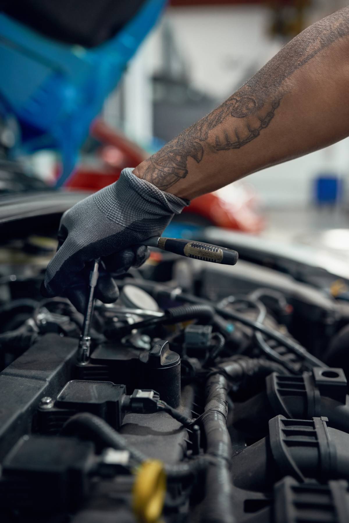 Man with screwdriver working with engine