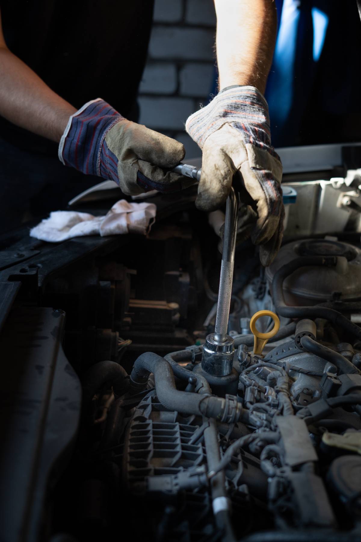 Man with screwdriver working with engine