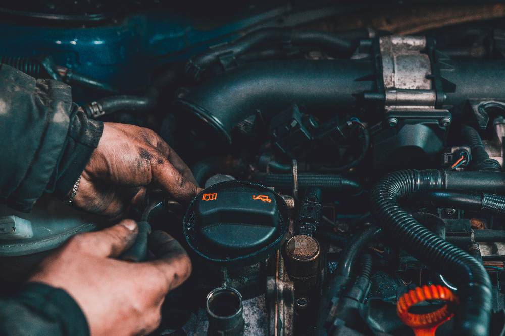 the master repairs the engine in the car service during a malfunction